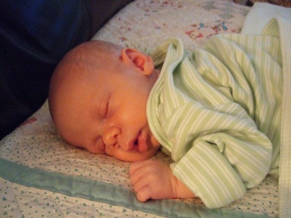 Daniel on couch on Mammy quilt